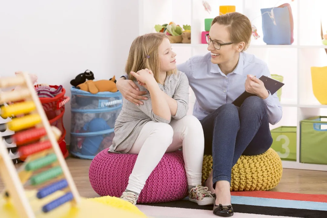 a woman talking to a child